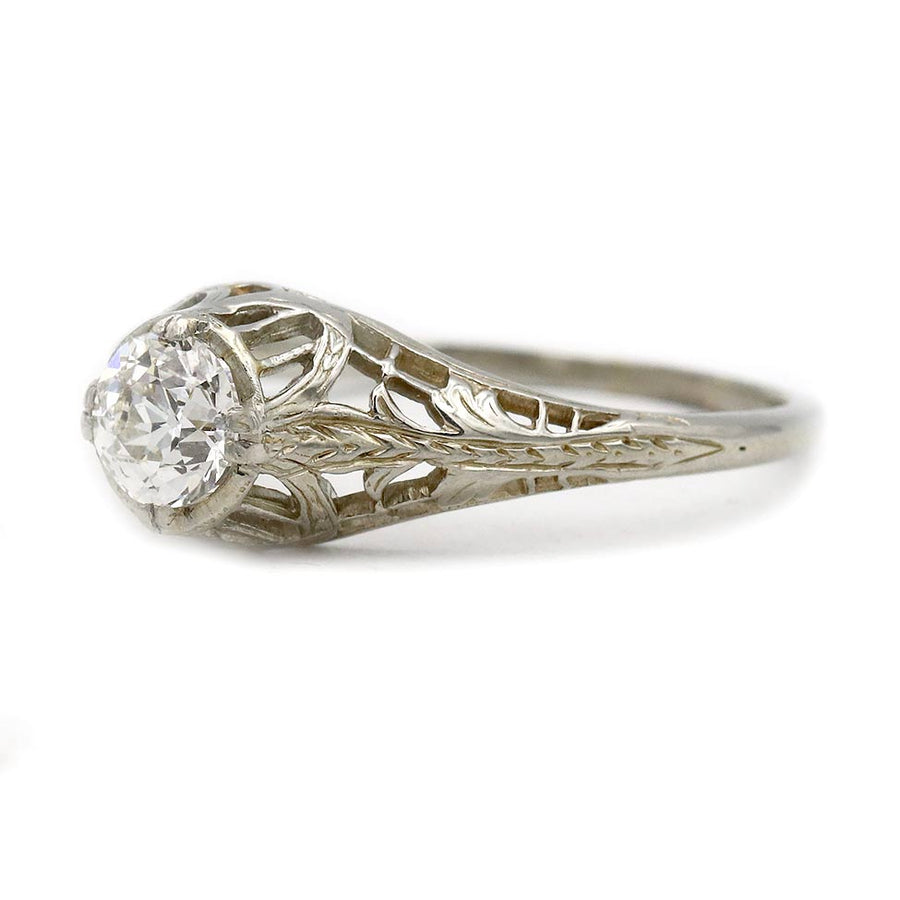 Side profile of Art Deco solitaire diamond ring in 18 karat white gold with filigree