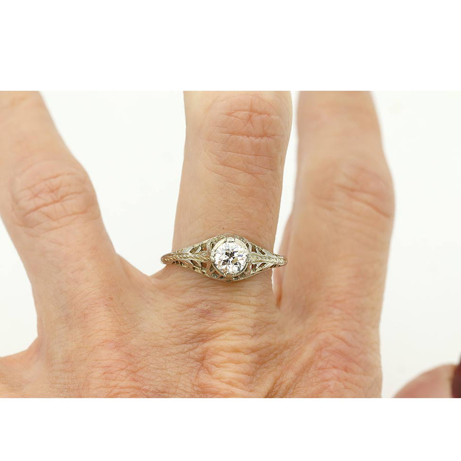 Art Deco .55 ct diamond engagement ring in 18k white gold worn on hand