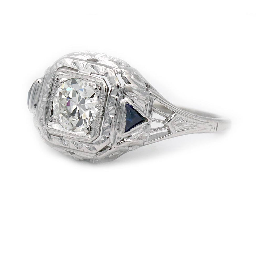 Art Deco engagement ring .51 carat GIA certified old European cut diamond G SI1 with triangle sapphire accents side view.