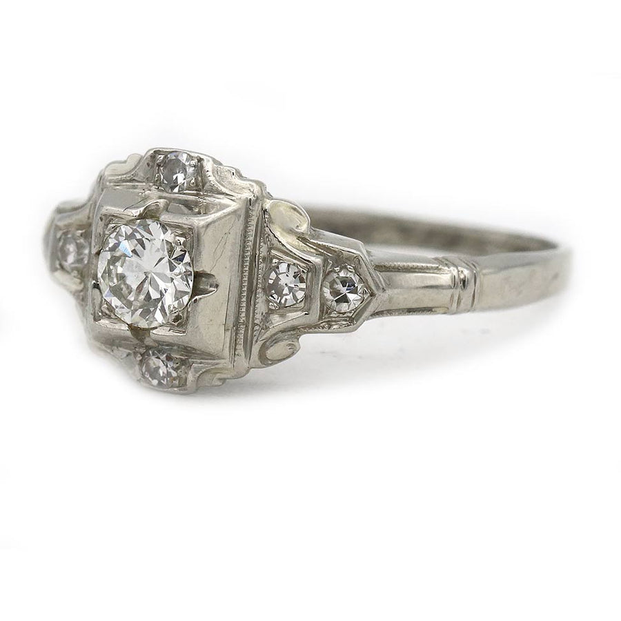 side profile of art deco 18 kt white gold engagement ring with old european cut diamond and milgrain