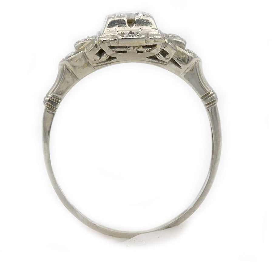 vintage art deco white gold engagement ring with .25 ct old european cut diamond and filigree details