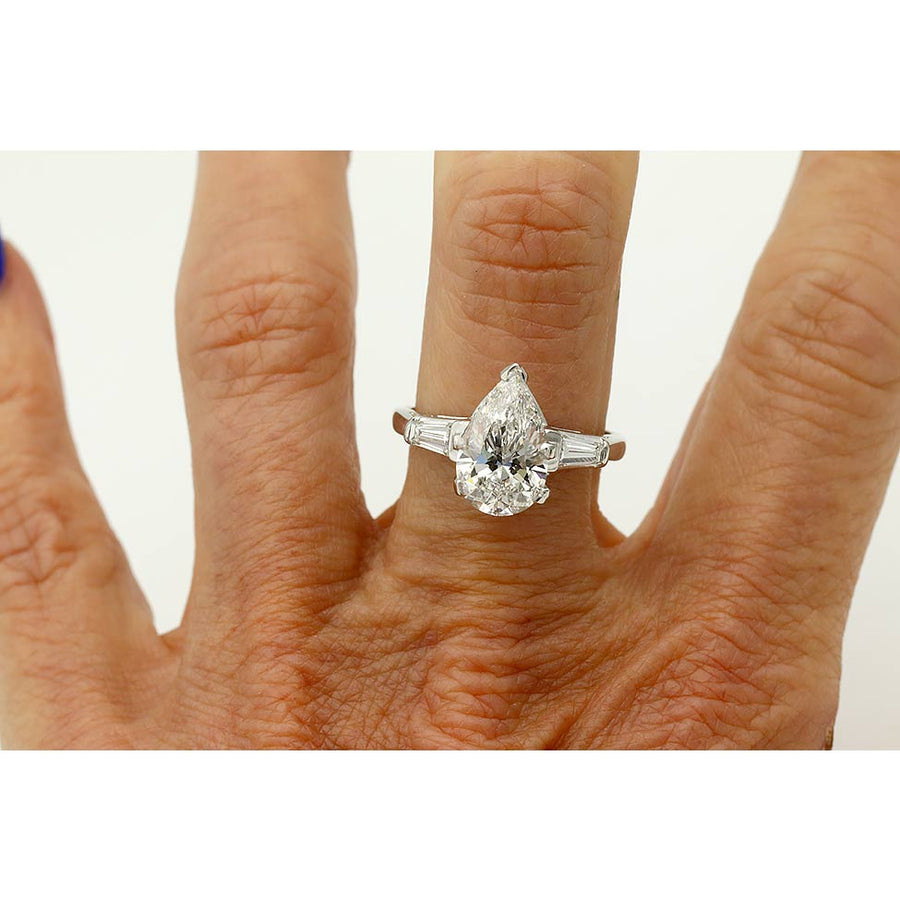 Vintage pear shape three stone engagement ring 2.51 carat IGI certified lab grown diamond E VS1 in platinum circa 1970s on hand.