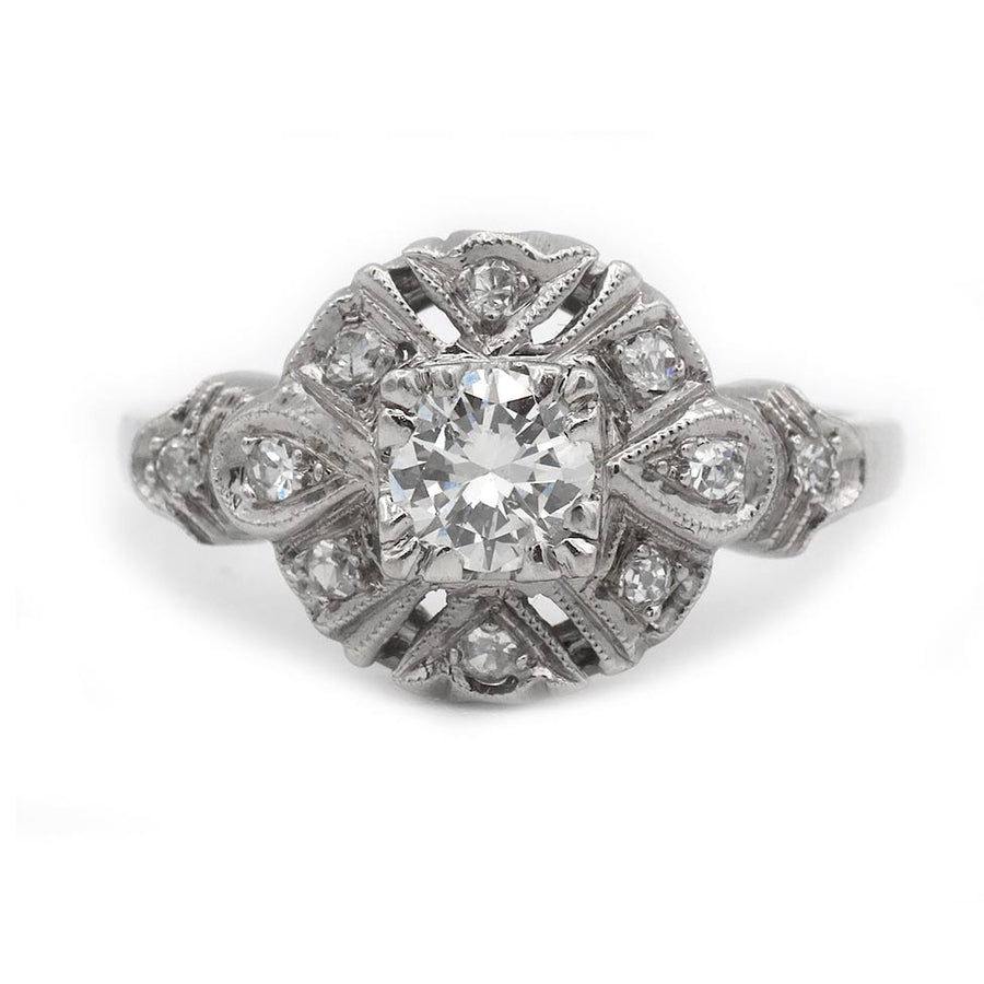 Uzele: .68 CTW Transitional Cut Diamond Mid-Century Halo Ring (1960s)