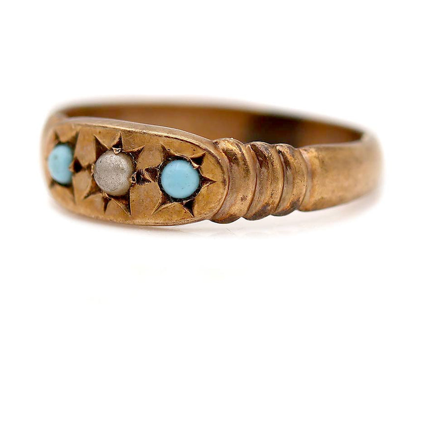Side profile of a dainty Victorian starburst wedding ring with turquoise and pearl accents in rose gold