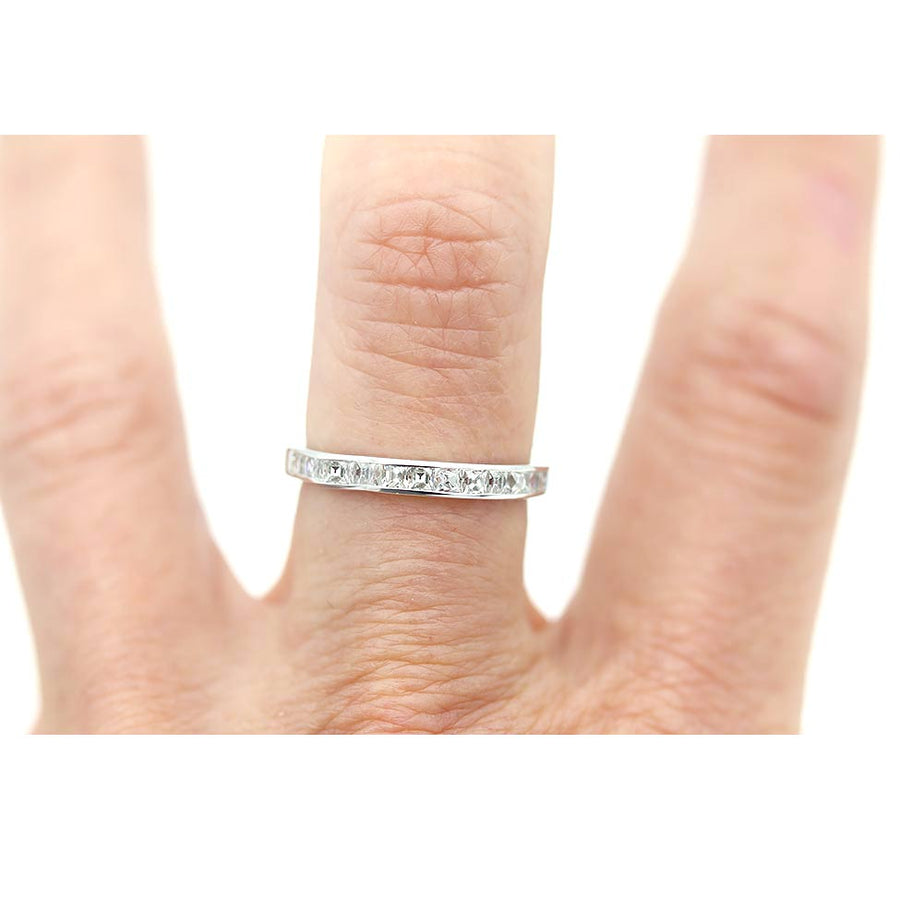 Vintage style French cut diamond wedding band in platinum on hand