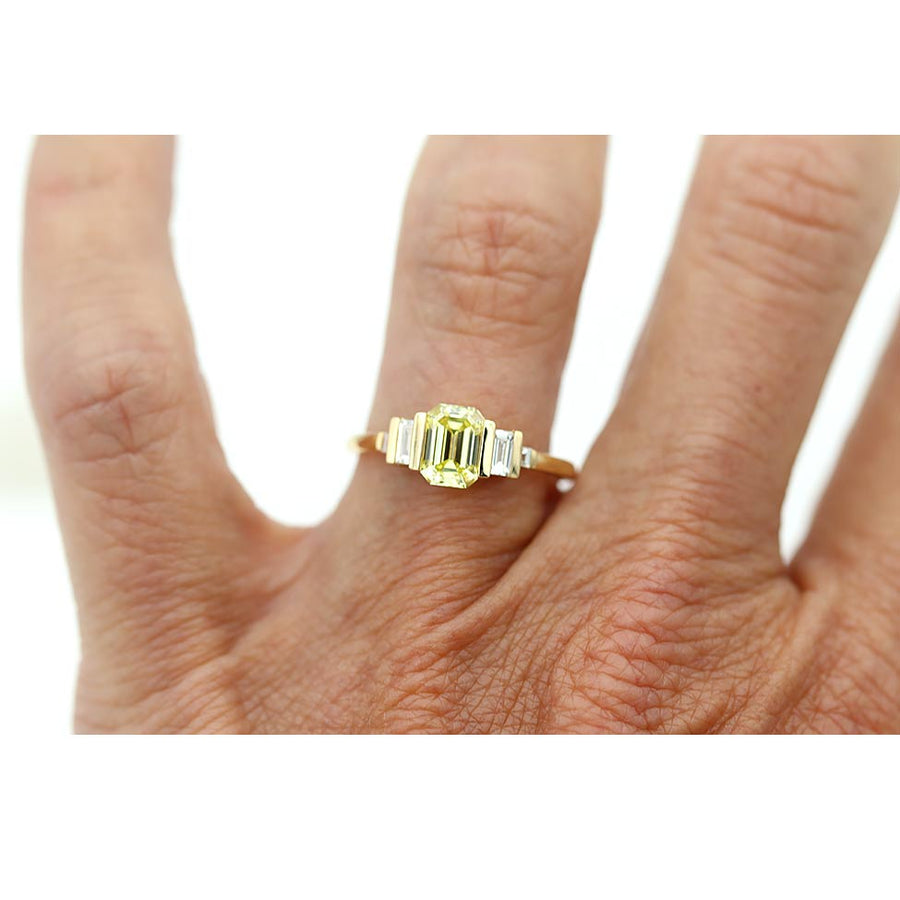 Recycled 18k yellow gold engagement ring with emerald cut yellow diamond