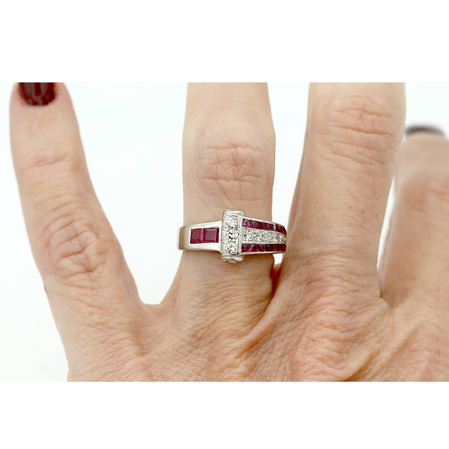 art deco burma ruby and diamond platinum engagement ring shown on a finger