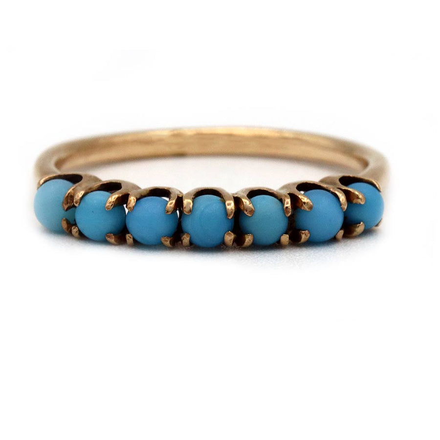 Victorian turquoise wedding band in 10k rose gold with seven cabochon turquoise stones