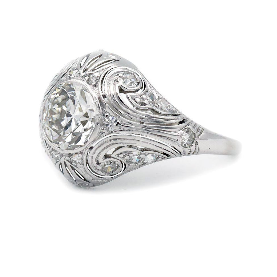 Side profile of platinum Art Deco ring showing low-profile bezel setting and hand-carved engravings