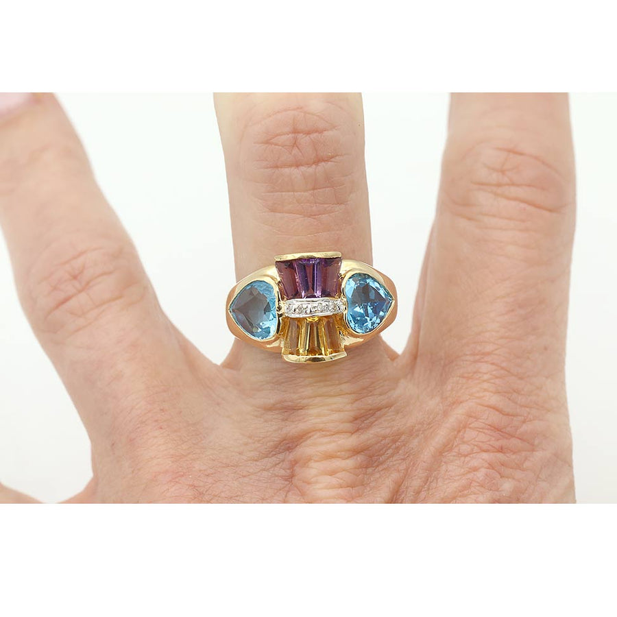 Retro gemstone ring with pear shaped blue topaz on hand