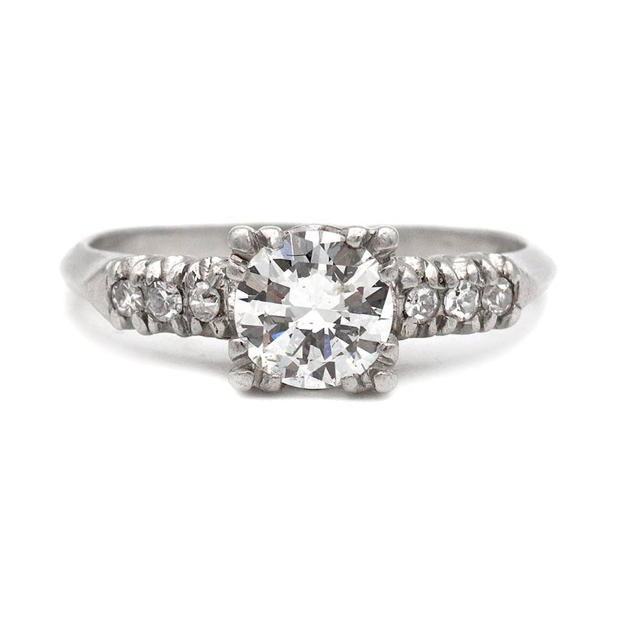 Mid-Century platinum engagement ring featuring a .75 carat transitional cut diamond in trefoil prongs with transitional cut diamond accents.