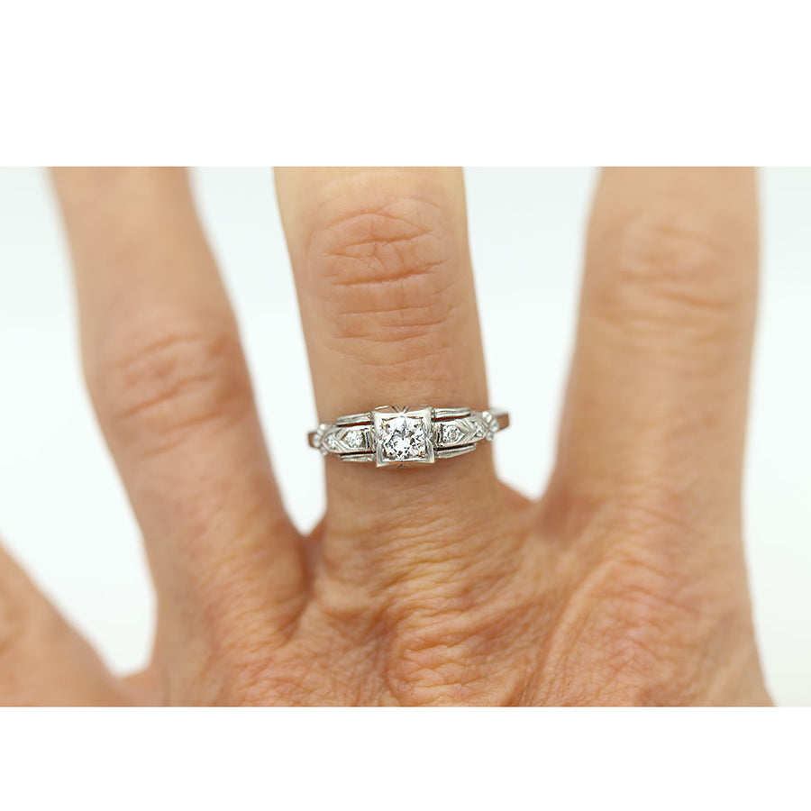 vintage geometric diamond ring with square frame and milgrain detailing circa 1930s on hand