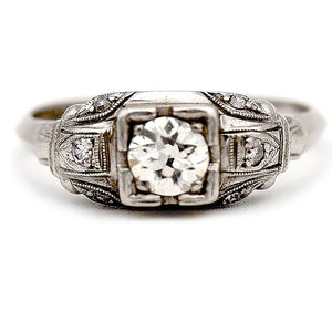 Art Deco old European cut diamond vintage engagement ring in platinum with geometric square frame and milgrain detail