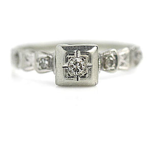 Vintage .16 CTW Old Mine Cut Diamond Engagement Ring with Buckle Motif