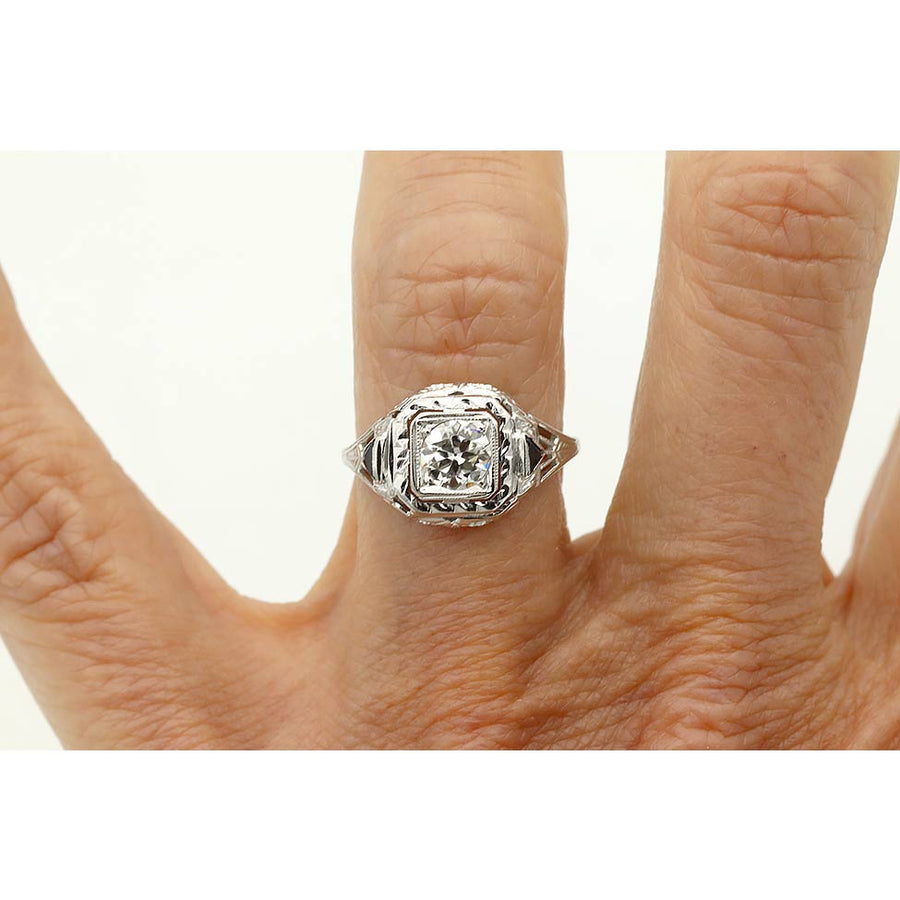 Art Deco engagement ring .51 carat GIA certified old European cut diamond G SI1 with triangle sapphire accents in 18K white gold on hand.