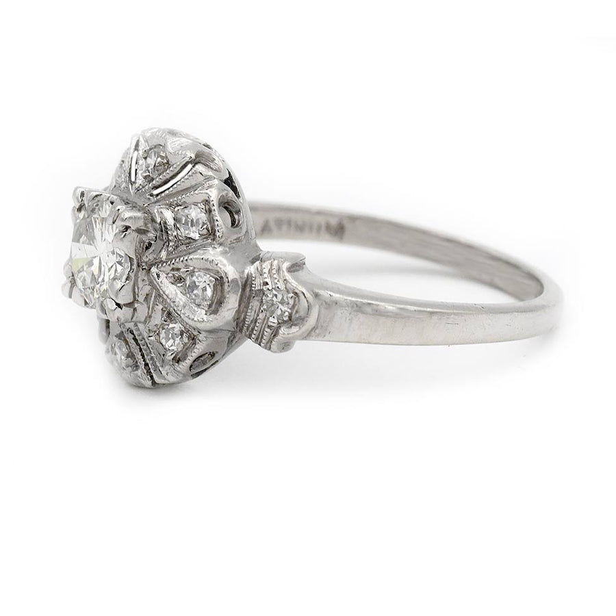 Uzele: .68 CTW Transitional Cut Diamond Mid-Century Halo Ring (1960s)