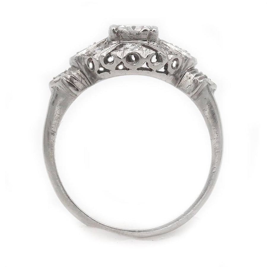 Uzele: .68 CTW Transitional Cut Diamond Mid-Century Halo Ring (1960s)