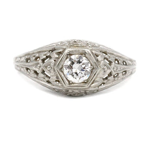 Art Deco engagement ring with .30 carat old European cut diamond H SI1 in 18K white gold geometric hexagonal frame with filigree milgrain detailing circa 1930s