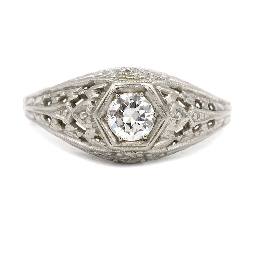 Art Deco engagement ring with .30 carat old European cut diamond H SI1 in 18K white gold geometric hexagonal frame with filigree milgrain detailing circa 1930s