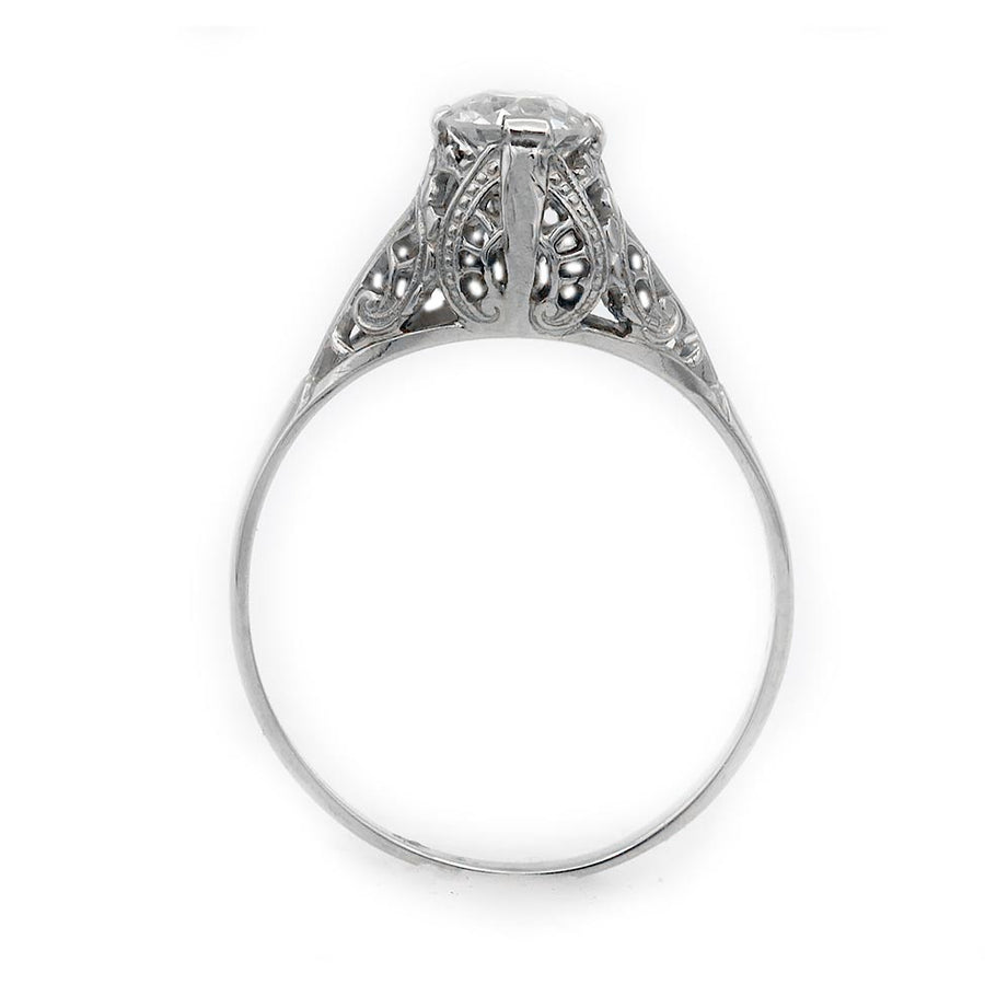 Art Deco old European cut diamond solitaire ring in 14K white gold featuring a  filigree engraving, and milgrain detail.