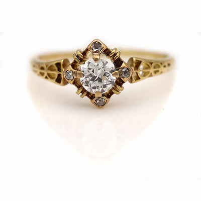 Victorian era antique diamond engagement ring with incredible scroll work  on the sides