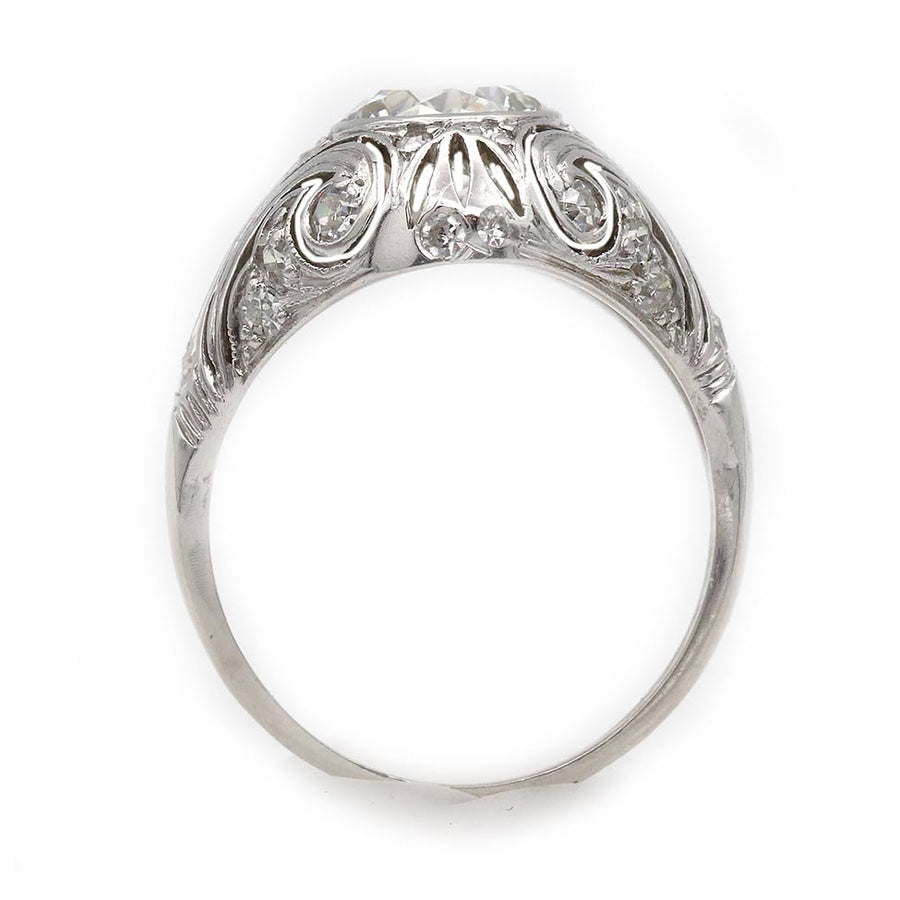 platinum Art Deco ring showing low-profile bezel setting and hand-carved engravings