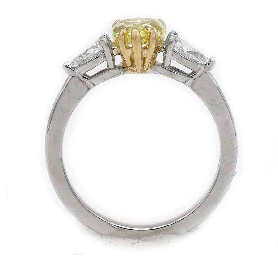 Gallery view of 1.02 carat fancy intense yellow pear shape diamond flanked by white pear shape diamond accents