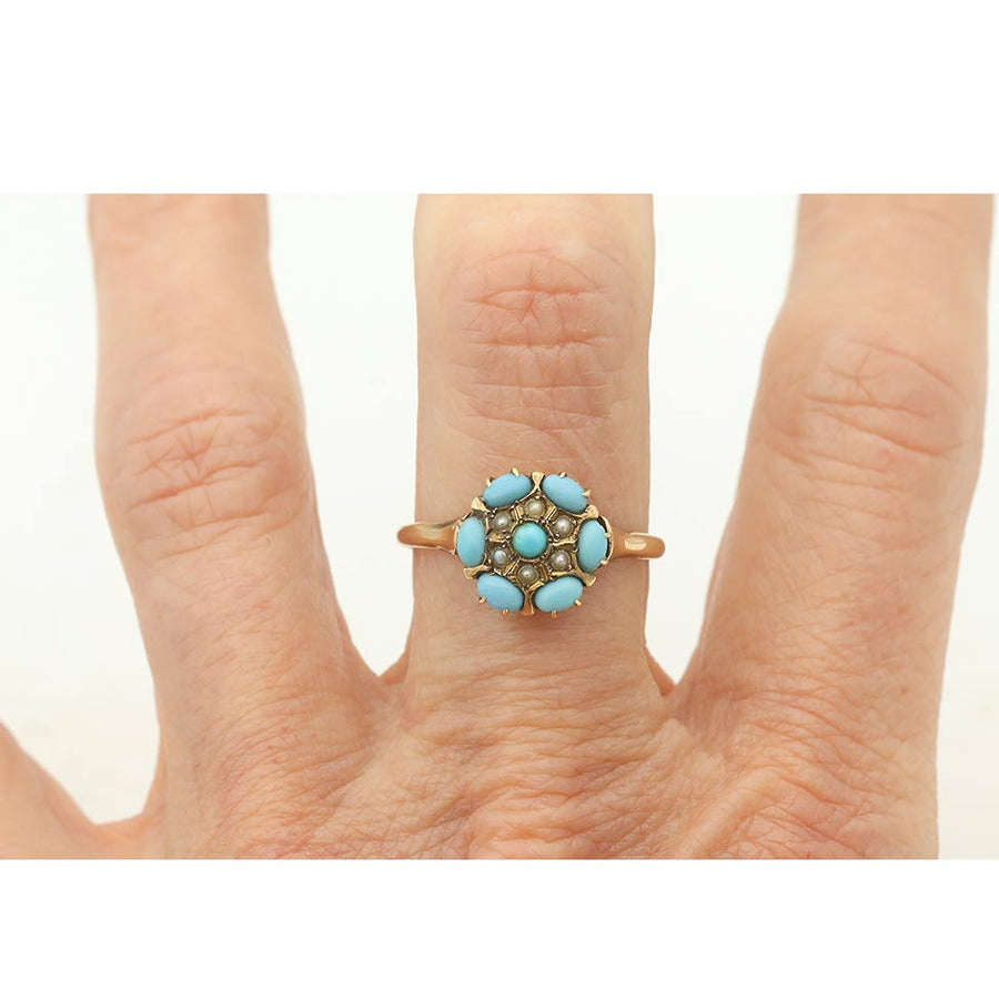 Early 1900s turquoise and pearl antique ring on hand