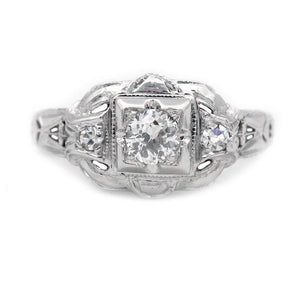 Art Deco three stone engagement ring in 14K white gold featuring an old European cut diamond in a geometric square frame with diamond side stones.