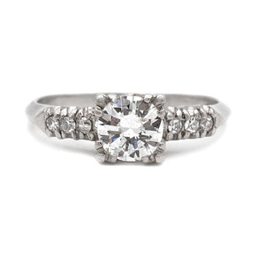Mid-Century platinum engagement ring featuring a .75 carat transitional cut diamond in trefoil prongs with transitional cut diamond accents.