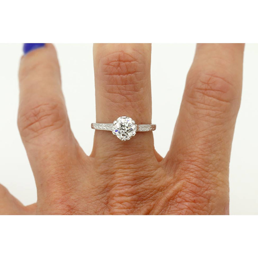 Art Deco platinum solitaire engagement ring .97 carat GIA certified old European cut diamond G SI2 six-prong setting hand engraved circa 1920s on hand