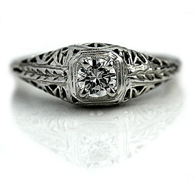 Vintage Solitaire Engagement Ring with Open Metal Work